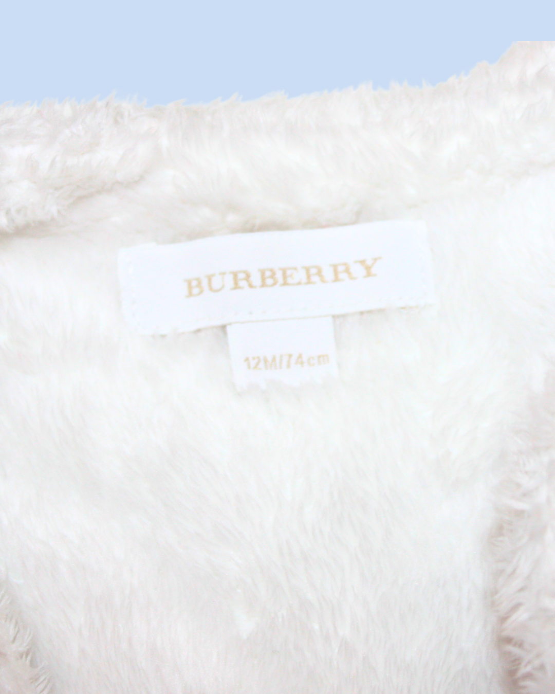 Veste fourrée beige 12 mois