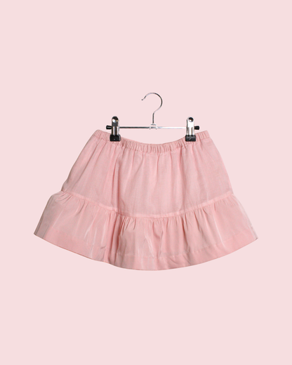 Jupe courte rose à volant et signature 4 ans